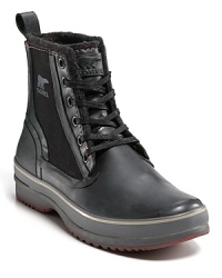 Sporting the profile of the classic b-ball sneaker, this sturdy waterproof boot boasts a breathable wool lining, canvas upper and sealed rubber sides and sole. Sporting the profile of the classic b-ball sneaker, this sturdy waterproof boot boasts a breathable wool lining, canvas upper and sealed rubber sides and sole.