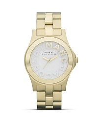 Work a sleek accessory with this gold-plated stainless steel watch from MARC BY MARC JACOBS. With a striking profile and raised logo markers, it encapsulates understated cool. Work a sleek accessory with this gold-plated stainless steel watch from MARC BY MARC JACOBS. With a striking profile and raised logo markers, it encapsulates understated cool.
