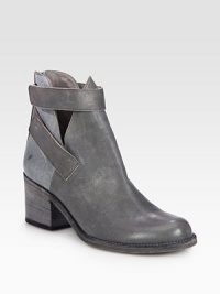 An elevated, street-cool style of distressed leather with an exposed back zip, sexy cutouts and easy velcro straps. Stacked heel, 2½ (65mm)Leather upper with velcro strapsBack zipLeather lining and solePadded insoleImportedOUR FIT MODEL RECOMMENDS ordering true size. 