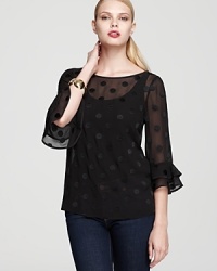 Dainty dots grace the sheer silhouette of this kate spade new york top, finished with ruffled bell sleeves for a demure yet dramatic look. Dainty dots grace the sheer silhouette of this kate spade new york top, finished with ruffled bell sleeves for a demure yet dramatic look.