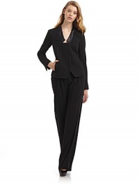 THE LOOKSatin banded collarLightly padded shouldersConcealed front button closureLong sleeves with concealed button cuffsTwo front welt pocketsPrincess seamsBack ventTHE FITAbout 24 from shoulder to hemTHE MATERIALBody: 65% triacetate/35% polyamideTrim: polyesterSilk linedCARE & ORIGINDry cleanMade in USA THE LOOKSatin banded collarLightly padded shouldersConcealed front button closureLong sleeves with concealed button cuffsTwo front welt pocketsPrincess seamsBack ventTHE FITAbout 24 from shoulder to hemTHE MATERIALBody: 65% triacetate/35% polyamideTrim: polyesterSilk linedCARE & ORIGINDry cleanMade in USA