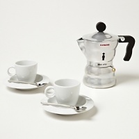 Exclusively ours, this set includes an espresso maker, 2 cups with saucers and 2 spoons. Makes 3 cups of espresso. Exclusively ours, this set includes an espresso maker, 2 cups with saucers and 2 spoons. Makes 3 cups of espresso.
