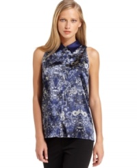 T Tahari's silky printed top looks polished with a solid point collar and buttoned front placket.