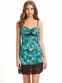 THE LOOKAdjustable shoulder strapsTiger patterned jerseyV neckline with scalloped laceRuched at center frontLace insert at Empire waist and hemTHE FITAbout 33 from shoulder to hemTHE MATERIAL92% polyester/8% spandexTrim: 60% nylon/23% rayon/17% spandexCARE & ORIGINMachine washImported THE LOOKAdjustable shoulder strapsTiger patterned jerseyV neckline with scalloped laceRuched at center frontLace insert at Empire waist and hemTHE FITAbout 33 from shoulder to hemTHE MATERIAL92% polyester/8% spandexTrim: 60% nylon/23% rayon/17% spandexCARE & ORIGINMachine washImported