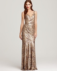 Make a glittering entrance in this lavish David Meister sequin gown, boasting luxurious draping for an elegant finish. Make a glittering entrance in this lavish David Meister sequin gown, boasting luxurious draping for an elegant finish.