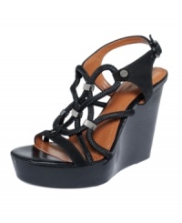 Textured with lots of loops. Calvin Klein's Ellis high wedge sandals feature looped rope-like straps and an uber-tall wedge. Textured with lots of loops. Calvin Klein's Ellis high wedge sandals feature looped rope-like straps and an uber-tall wedge.