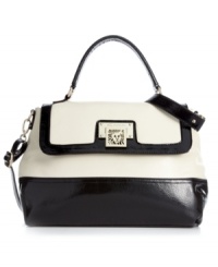Colorblocking is the craze and this classic design by AK Anne Klein takes the trend to a new level of luxury. Shimmery silver-tone hardware, signature front detailing and posh zebra print lining make this look the silhouette of the season. Colorblocking is the craze and this classic design by AK Anne Klein takes the trend to a new level of luxury. Shimmery silver-tone hardware, signature front detailing and posh zebra print lining make this look the silhouette of the season.