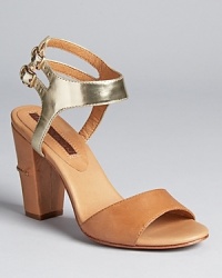 A bi-color design from Modern Vintage, featuring a trend-right block heel with ladylike appeal. A bi-color design from Modern Vintage, featuring a trend-right block heel with ladylike appeal.