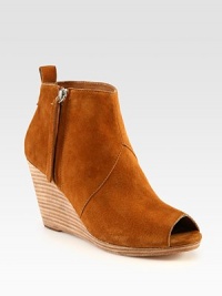 Supported by a stacked wedge and slight platform, this buttery suede silhouette has a side zipper, back pull tab and peep toe. Stacked wedge, 3 (75mm)Stacked platform, ½ (15mm)Compares to a 2½ heel (65mm)Suede upperSide zipperLeather lining and solePadded insoleImportedOUR FIT MODEL RECOMMENDS ordering one half size up as this style runs small. Supported by a stacked wedge and slight platform, this buttery suede silhouette has a side zipper, back pull tab and peep toe. Stacked wedge, 3 (75mm)Stacked platform, ½ (15mm)Compares to a 2½ heel (65mm)Suede upperSide zipperLeather lining and solePadded insoleImportedOUR FIT MODEL RECOMMENDS ordering one half size up as this style runs small.