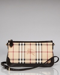 Wallet by day, clutch by night, this chic little Burberry wristlet is elegantly versatile.