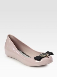 Grosgrain bow with an owl embellishment and a slight peep toe characterize this shiny silhouette. Rubber upperRubber lining and solePadded insoleImportedOUR FIT MODEL RECOMMENDS ordering one half size down as this style runs large. Grosgrain bow with an owl embellishment and a slight peep toe characterize this shiny silhouette. Rubber upperRubber lining and solePadded insoleImportedOUR FIT MODEL RECOMMENDS ordering one half size down as this style runs large.