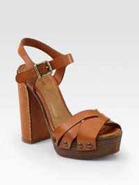 Richly hued leather with a chunky heel, adjustable ankle strap and decorative stitching. Leather-covered heel, 5 (125mm)Covered platform, 1½ (40mm)Compares to a 3½ heel (90mm)Shaft, 17Adjustable leg circumference, 15Leather upperLeather liningWooden solePadded insoleMade in ItalyOUR FIT MODEL RECOMMENDS ordering one size up as this style runs small. Richly hued leather with a chunky heel, adjustable ankle strap and decorative stitching. Leather-covered heel, 5 (125mm)Covered platform, 1½ (40mm)Compares to a 3½ heel (90mm)Shaft, 17Adjustable leg circumference, 15Leather upperLeather liningWooden solePadded insoleMade in ItalyOUR FIT MODEL RECOMMENDS ordering one size up as this style runs small.