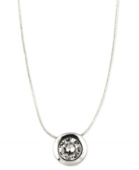 A shining statement. Nine West's necklace is crafted from silver-tone mixed metal with a circular pendant featuring cubic zirconias (2 ct. t.w.) for a stunning effect. Approximate length: 16 inches + 2-inch extender. A shining statement. Nine West's necklace is crafted from silver-tone mixed metal with a circular pendant featuring cubic zirconias (2 ct. t.w.) for a stunning effect. Approximate length: 16 inches + 2-inch extender.
