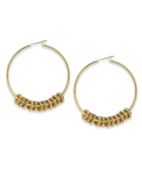 A bevy of discs shimmy and shake with glittering crystal accents on these hoop earrings from Alfani. Crafted in 12k gold-plated mixed metal. Approximate diameter: 2 inches. A bevy of discs shimmy and shake with glittering crystal accents on these hoop earrings from Alfani. Crafted in 12k gold-plated mixed metal. Approximate diameter: 2 inches.