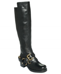 The belted harness around the ankle of Lisa for Donald Pliner's Adait tall riding boots adds eye-catching detail to this smooth, tall style. The belted harness around the ankle of Lisa for Donald Pliner's Adait tall riding boots adds eye-catching detail to this smooth, tall style.