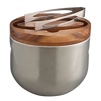 Nothing helps break the ice like Neil Cohen's Ice Bucket, a welcome new addition to our Mikko line. An intriguing marriage of acacia wood and signature Nambé 18/10 stainless steel, the inner steel bucket is handsomely ringed by a wood that strides the outer steel of the bucket. Nothing helps break the ice like Neil Cohen's Ice Bucket, a welcome new addition to our Mikko line. An intriguing marriage of acacia wood and signature Nambé 18/10 stainless steel, the inner steel bucket is handsomely ringed by a wood that strides the outer steel of the bucket.