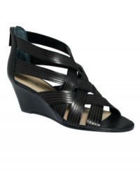 A sophisticated twist. Summer style takes a dressy turn thanks to Bandolino's Janeera wedge sandals. With a zipper closure at back, they feature a wearable stacked wedge heel. A sophisticated twist. Summer style takes a dressy turn thanks to Bandolino's Janeera wedge sandals. With a zipper closure at back, they feature a wearable stacked wedge heel.
