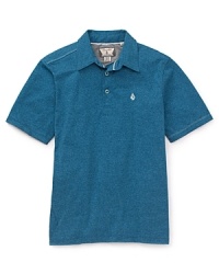 The classic polo is updated in a cotton slub with cool asymmetrical piecing along the shoulder and sides. The classic polo is updated in a cotton slub with cool asymmetrical piecing along the shoulder and sides.
