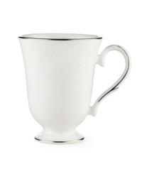 Beautiful and bridal-inspired, this classic white mug is richly textured with a delicate floral motif and raised, beaded accents. Finished with a band of polished platinum. Beautiful and bridal-inspired, this classic white mug is richly textured with a delicate floral motif and raised, beaded accents. Finished with a band of polished platinum.