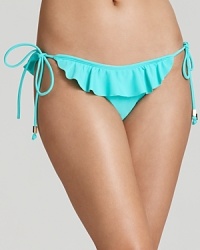 Romantic ruffles are ready to make a splash with this string bikini from Shoshanna. In a sold colorway this suit will add a cool, beachy vibe to your swimwear collection.