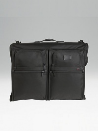 Tumi's original garment bag design, still sought after by business travelers. Universal hanger bracket for any hanger type Specially shaped pockets for shoes, accessories, belts and hair dryers Top carry handle and removable shoulder strap Add-a-bag sleeve lets it ride on wheeled cases Tumi Tracer Protection Ballistic nylon Imported 18H X 23½W X 5½D Tumi's original garment bag design, still sought after by business travelers. Universal hanger bracket for any hanger type Specially shaped pockets for shoes, accessories, belts and hair dryers Top carry handle and removable shoulder strap Add-a-bag sleeve lets it ride on wheeled cases Tumi Tracer Protection Ballistic nylon Imported 18H X 23½W X 5½D
