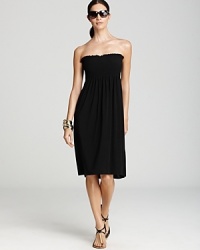 Perfect effortless sun style with this pull-on tube dress from Magicsuit. This easy-to-wear piece features smocking at the chest for silhouette enhancing glamour. Perfect effortless sun style with this pull-on tube dress from Magicsuit. This easy-to-wear piece features smocking at the chest for silhouette enhancing glamour.