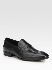 Sophisticated slip-on style crafted in smooth, supple leather and accented with an apron-toe finish.Leather upperLeather liningPadded insoleRubber soleImported Sophisticated slip-on style crafted in smooth, supple leather and accented with an apron-toe finish.Leather upperLeather liningPadded insoleRubber soleImported