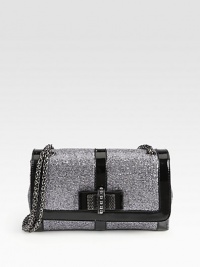 A structured style in a glittering finish with patent leather trim, a sweet bow and signature red lining.Double or single shoulder strap, 12½-22 dropPush-lock flap closureTwo open pockets under flapOne inside zip pocketOne inside open pocketSignature red lining10W X 6½H X 3DMade in Italy A structured style in a glittering finish with patent leather trim, a sweet bow and signature red lining.Double or single shoulder strap, 12½-22 dropPush-lock flap closureTwo open pockets under flapOne inside zip pocketOne inside open pocketSignature red lining10W X 6½H X 3DMade in Italy