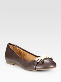 Burnished leather classic enhanced by a unique rope bow adornment and padded insole. Leather and rope upperLeather liningRubber solePadded insoleImported Burnished leather classic enhanced by a unique rope bow adornment and padded insole. Leather and rope upperLeather liningRubber solePadded insoleImported