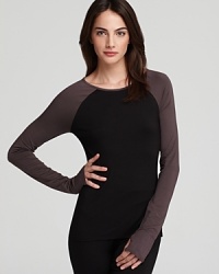 Tried-and-true Calvin Klein comfort meets sporty styling in this lounge top with baseball-tee sleeves and thumbholes. Tried-and-true Calvin Klein comfort meets sporty styling in this lounge top with baseball-tee sleeves and thumbholes.