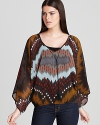 This Sanctuary blouse features stylish wide Dolman sleeves in a fluid poncho-style silhouette, embracing fall's most welcome trend of boxy tops in silky-soft fabrics. This Sanctuary blouse features stylish wide Dolman sleeves in a fluid poncho-style silhouette, embracing fall's most welcome trend of boxy tops in silky-soft fabrics.
