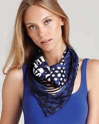 Iconic gancinis and various animal prints decorate an elegant silk scarf from Salvatore Ferragamo. Iconic gancinis and various animal prints decorate an elegant silk scarf from Salvatore Ferragamo.