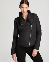 Infuse your outerwear repertoire with modern edge as an asymmetrical zip punctuates the plush body of this DKNY puffer jacket. Infuse your outerwear repertoire with modern edge as an asymmetrical zip punctuates the plush body of this DKNY puffer jacket.