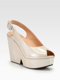 Luminous metallic suede peep-toe pump, artfully crafted in France. Self-covered wedge, 4¼ (110mm)Covered platform, 1½ (40mm)Compares to a 2¾ heel (70mm)Metallic suede upperPeep toeAdjustable slingback strapLeather lining and solePadded insoleMade in France Luminous metallic suede peep-toe pump, artfully crafted in France. Self-covered wedge, 4¼ (110mm)Covered platform, 1½ (40mm)Compares to a 2¾ heel (70mm)Metallic suede upperPeep toeAdjustable slingback strapLeather lining and solePadded insoleMade in France