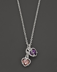 A twin heart necklace in pink and raspberry crystal framed in sterling silver. Designed by Judith Ripka. A twin heart necklace in pink and raspberry crystal framed in sterling silver. Designed by Judith Ripka.
