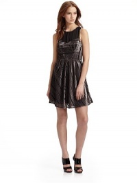 This alluring A-line style with a sheer yoke and unexpected cutout back, echoes mystery and elegance.Scoopneck Sleeveless Sheer yoke Sweetheart seaming Seamed waist Pleated skirt Exposed back zipper Cutout back details About 34 from shoulder to hem Fully lined 65% viscose/35% silk Dry clean Imported This alluring A-line style with a sheer yoke and unexpected cutout back, echoes mystery and elegance.Scoopneck Sleeveless Sheer yoke Sweetheart seaming Seamed waist Pleated skirt Exposed back zipper Cutout back details About 34 from shoulder to hem Fully lined 65% viscose/35% silk Dry clean Imported