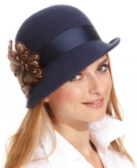 Take your style to a new level of chic with this classic cloche from Collection XIIX. Soft 100% wool is accented with a tonal ribbon and free-spirited feather, for a look that's instantly eye-catching. Take your style to a new level of chic with this classic cloche from Collection XIIX. Soft 100% wool is accented with a tonal ribbon and free-spirited feather, for a look that's instantly eye-catching.