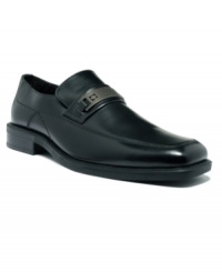 A silvertone metal bit at the vamp on this pair of men's dress shoes is a perfectly polished complement to the sleek lines and smooth leather of these slip-on men's loafers from Kenneth Cole Reaction. A silvertone metal bit at the vamp on this pair of men's dress shoes is a perfectly polished complement to the sleek lines and smooth leather of these slip-on men's loafers from Kenneth Cole Reaction.