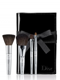 This deluxe travel brush set includes deluxe sizes of Dior's Backstage Powder, Cheek, Eyeshadow and Lip brushes in a foldable patent brush roll. This deluxe travel brush set includes deluxe sizes of Dior's Backstage Powder, Cheek, Eyeshadow and Lip brushes in a foldable patent brush roll.
