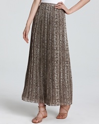 Scale up your look with this snake-print MICHAEL Michael Kors maxi skirt, brimming with delicate pleats for exotic elegance. Scale up your look with this snake-print MICHAEL Michael Kors maxi skirt, brimming with delicate pleats for exotic elegance.