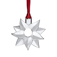Delightfully heritage-minded yet modern and whimsical, this crystal poinsettia is the 2012 annual ornament from Orrefors. Continue the tradition - or start a new one. Delightfully heritage-minded yet modern and whimsical, this crystal poinsettia is the 2012 annual ornament from Orrefors. Continue the tradition - or start a new one.
