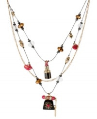 Become the talk of the town with this illusion necklace from Betsey Johnson. Crafted from gold-tone mixed metal, the necklace features glass telephone, lip and lipstick charms throughout. Approximate length: 16 inches + 3-inch extender. Approximate drop: 3 inches. Become the talk of the town with this illusion necklace from Betsey Johnson. Crafted from gold-tone mixed metal, the necklace features glass telephone, lip and lipstick charms throughout. Approximate length: 16 inches + 3-inch extender. Approximate drop: 3 inches.