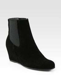 Ultra-comfortable suede ankle boot with a hidden wedge and stretchy elastic panels for easy wear. Hidden wedge, 3¼ (80mm)Suede upper with side elastic panelsPull-on styleLeather liningRubber solePadded insoleMade in Spain Ultra-comfortable suede ankle boot with a hidden wedge and stretchy elastic panels for easy wear. Hidden wedge, 3¼ (80mm)Suede upper with side elastic panelsPull-on styleLeather liningRubber solePadded insoleMade in Spain