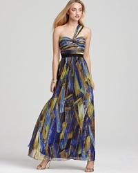 With shimmering, golden stripes, BCBGMAXAZRIA's long, one shouldered dress makes a grand entrance. With shimmering, golden stripes, BCBGMAXAZRIA's long, one shouldered dress makes a grand entrance.