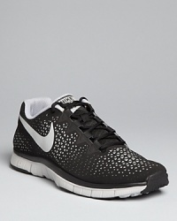 This dynamic minimal-training sneaker features a laser-cut perforation skin and a mesh inner lining for an aesthetically unique high-performance design you'll love to wear whether you're at the gym or kicking around the soccer ball with friends. This dynamic minimal-training sneaker features a laser-cut perforation skin and a mesh inner lining for an aesthetically unique high-performance design you'll love to wear whether you're at the gym or kicking around the soccer ball with friends.