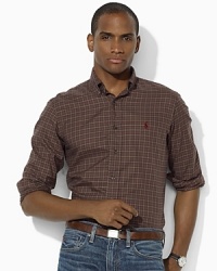 An essential sport shirt is crafted from lightweight woven cotton and tailored for a trim, modern fit. An essential sport shirt is crafted from lightweight woven cotton and tailored for a trim, modern fit.