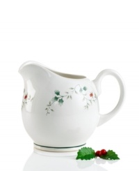 Create a serene winter scene with this festive motif from Pfaltzgraff. This gravy boat from the set of dinnerware and dishes has holly leaves and bright red berries that are accented with raised details and a green rim. Shown back right. (Clearance) Create a serene winter scene with this festive motif from Pfaltzgraff. This gravy boat from the set of dinnerware and dishes has holly leaves and bright red berries that are accented with raised details and a green rim. Shown back right. (Clearance)