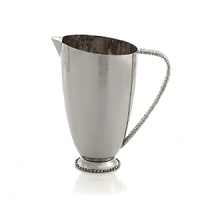 Marked by incredible handcrafting, this tall pitcher is embellished with countless molten beads carefully placed by a highly skilled artisan. The look is streamlined, timeless, organic and soulful. Marked by incredible handcrafting, this tall pitcher is embellished with countless molten beads carefully placed by a highly skilled artisan. The look is streamlined, timeless, organic and soulful.