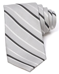 Diagonal stripes dash across a textured silk tie from The Men's Store at Bloomingdale's. Diagonal stripes dash across a textured silk tie from The Men's Store at Bloomingdale's.