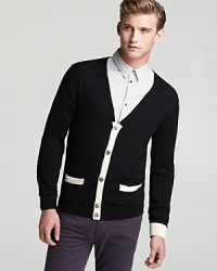 Spun in a regal blend of silk, cotton and cashmere for uncommon softness, this cardigan features alternating contrast trim for a lighthearted, whimsical design you'll wear to the new wine bar downtown. Spun in a regal blend of silk, cotton and cashmere for uncommon softness, this cardigan features alternating contrast trim for a lighthearted, whimsical design you'll wear to the new wine bar downtown.